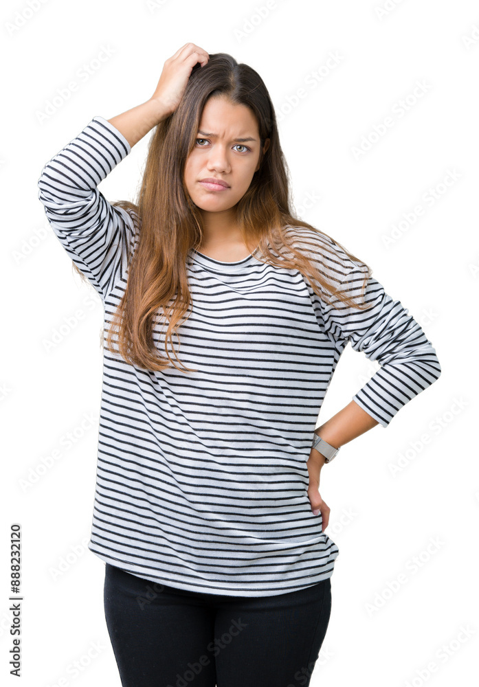 Sticker Young beautiful brunette woman wearing stripes sweater over isolated background confuse and wonder about question. Uncertain with doubt, thinking with hand on head. Pensive concept.