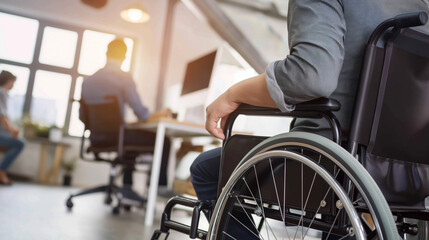 Fototapeta premium A wheelchair user in an office setting, with blurred workers and desks in the background, symbolizing the spellbinding scene of work life 