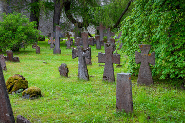 Old stone crosses on old monastery cemetery. St. Bridget’s Convent ruins in Tallinn, Estonia.