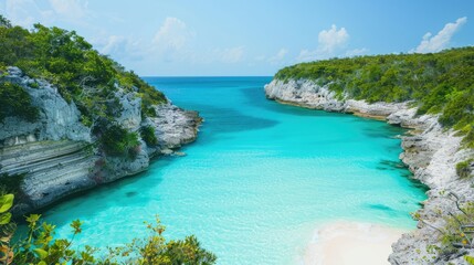 Fototapeta premium A secluded cove with turquoise waters and white sand