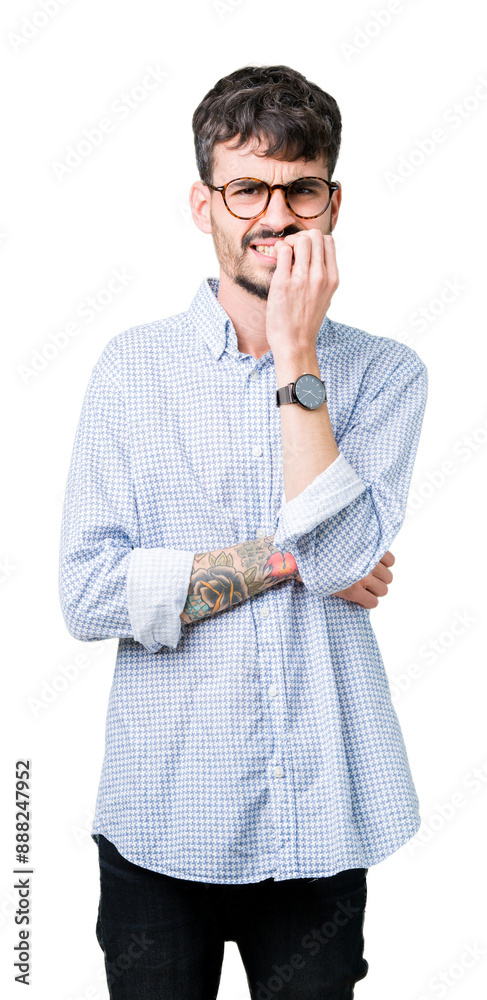 Sticker Young handsome man wearing glasses over isolated background looking stressed and nervous with hands on mouth biting nails. Anxiety problem.