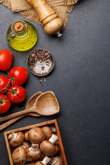 Spices, olive oil, and utensils on cooking table