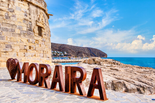 Moraira (Teulada-Moraira), Costa Blanca, Spain, Old town and promenade El Portet/L'Ampolla with castillo and Moraira lettering