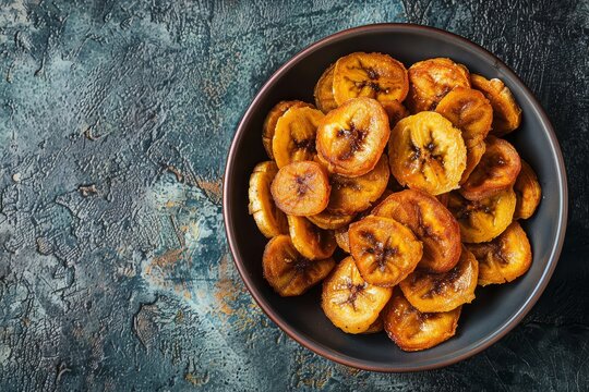 Crispy banana chips Latin American snack fried or baked slices Top view traditional dish called Chifles