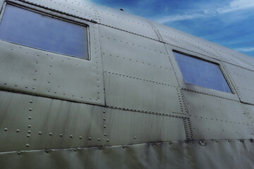 The board of a military airplane against the sky.