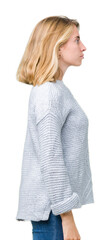 Beautiful young woman wearing winter sweater over isolated background looking to side, relax profile pose with natural face with confident smile.
