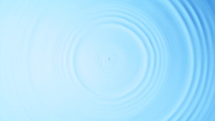 Top View of Water Circle Waves on Clear Blue Surface.