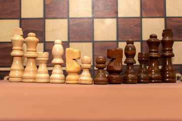Chess pieces on chess board background	