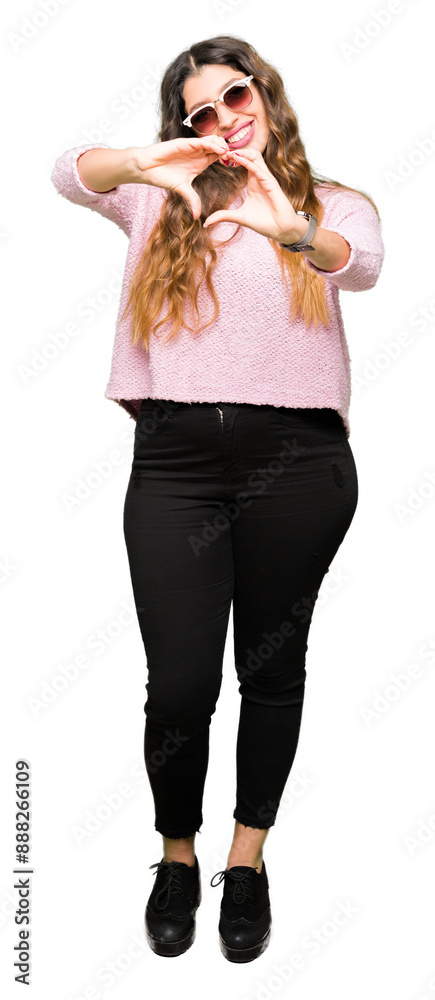 Poster young beautiful woman wearing sunglasses and pink sweater smiling in love showing heart symbol and s