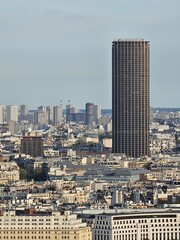 Paris, France - April 12, 2024: Aerial view of Paris skyline with dense urban sprawl and modern skyscrapers, Ile de France, France.  Amazing mix between modern skyscraoers and old buildings.