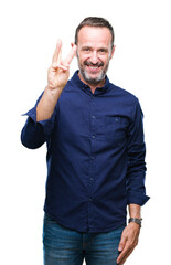 Fototapeta premium Middle age hoary senior man over isolated background showing and pointing up with fingers number three while smiling confident and happy.
