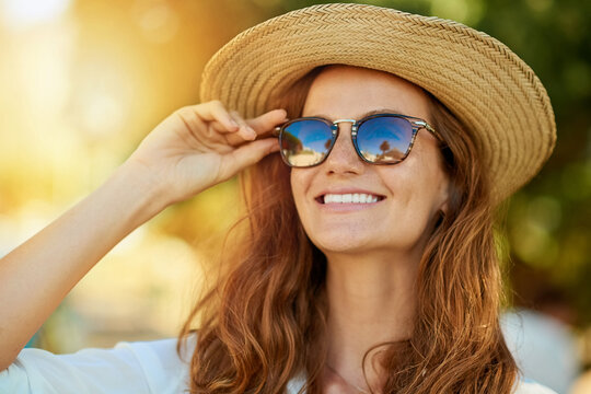 Woman, hat or sunglasses in outdoor with thinking for vacation, idea or travel in Thailand. Female tourist, nature or plan for holiday in tropical climate with lens flare, journey with sun safety