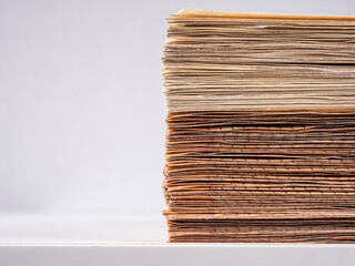 A stack of 50 euro banknotes on a white table, macro shot.
