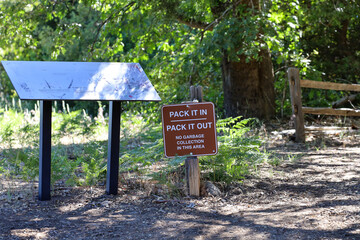The Pack It In, Pack It Out sign at the Silvercrest Picnic Area at Palomar Mountain in Southern California, USA.
