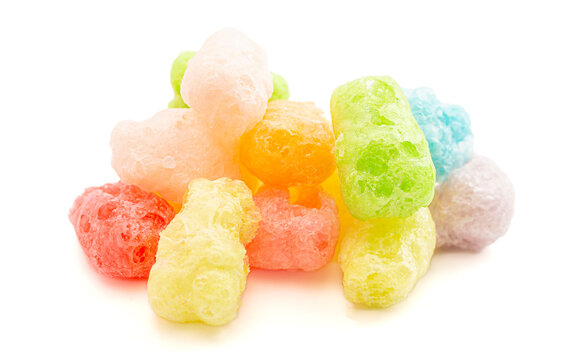 A Pile of Freeze Dried Gummy Bear Shaped Candies Isolated on a White Background