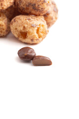 Crunchy Freeze Dried Milk Chocolate Covered Caramel Disks Isolated on White Background