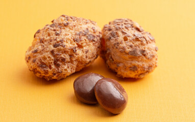 Freeze Dried Milk Chocolate Covered Caramel Disks on Yellow Background