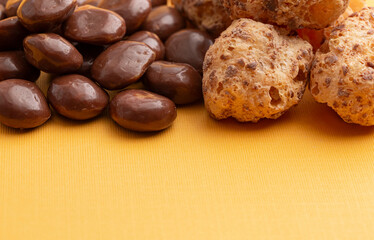 Freeze Dried Milk Chocolate Covered Caramel Disks on Yellow Background