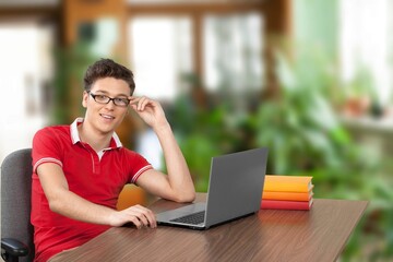 Happy business man posing in room background