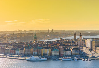 Fototapeta premium Stockholm old town - Gamla stan during a sunset. Aerial view of Sweden capital. Drone top panorama photo