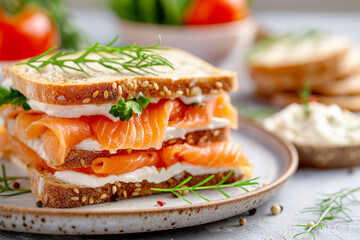 A sandwich with salmon and cream cheese on a plate