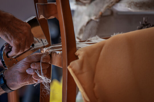 upholsterer craftsman working in the workshop