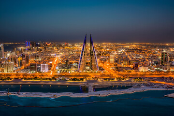 Enchanting night cityscapes of Manama, Bahrain, with its illuminated skyline, modern architecture, and vibrant nightlife. Perfect for travel enthusiasts seeking a glimpse of this Middle Eastern gem