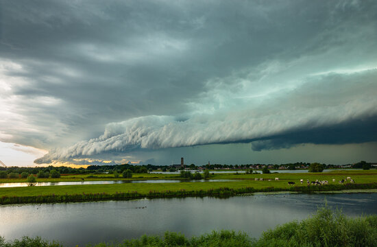 Stormy sky with shelf cloud over river Waal near Zaltbommel, Netherlands