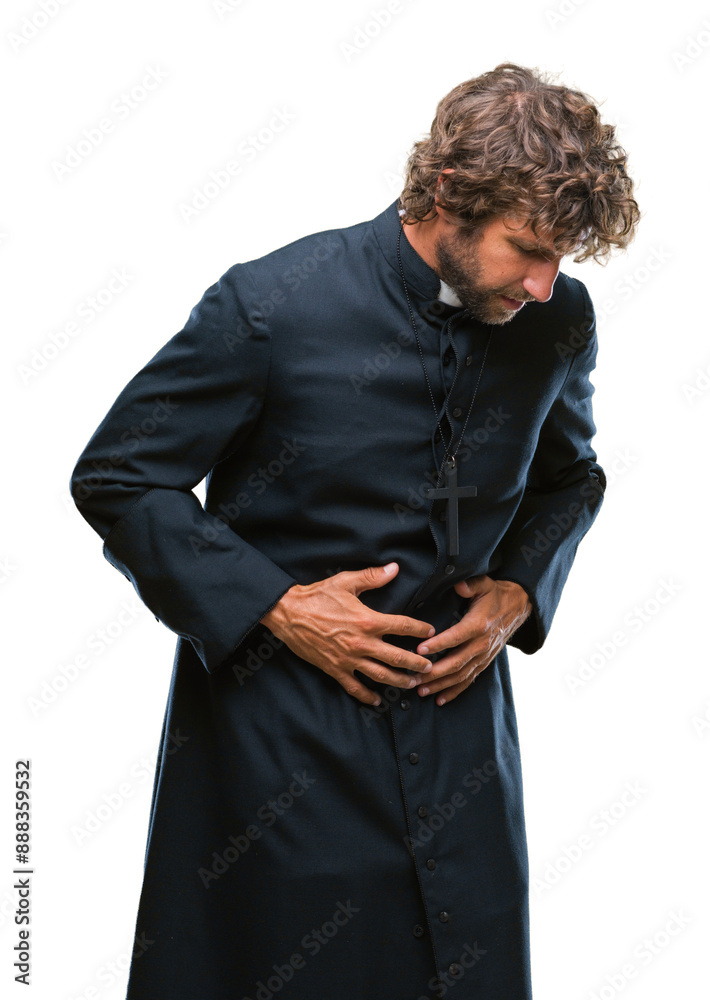 Wall mural Handsome hispanic catholic priest man over isolated background with hand on stomach because nausea, painful disease feeling unwell. Ache concept.