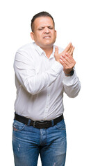 Fototapeta premium Middle age arab elegant man over isolated background Suffering pain on hands and fingers, arthritis inflammation