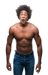 Fototapeta premium Afro american shirtless man showing nude body over isolated background afraid and shocked with surprise expression, fear and excited face.
