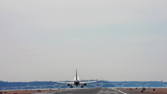 4k 30-second clip of a passenger plane landing at Reagan National Airport outside Washington, DC