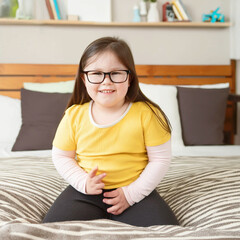 Obraz premium Girl with down syndrome, disability, playing in bedroom.