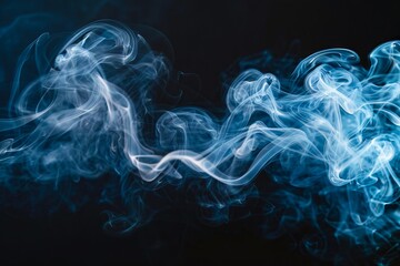 Fototapeta premium A blue smoke on a black background.