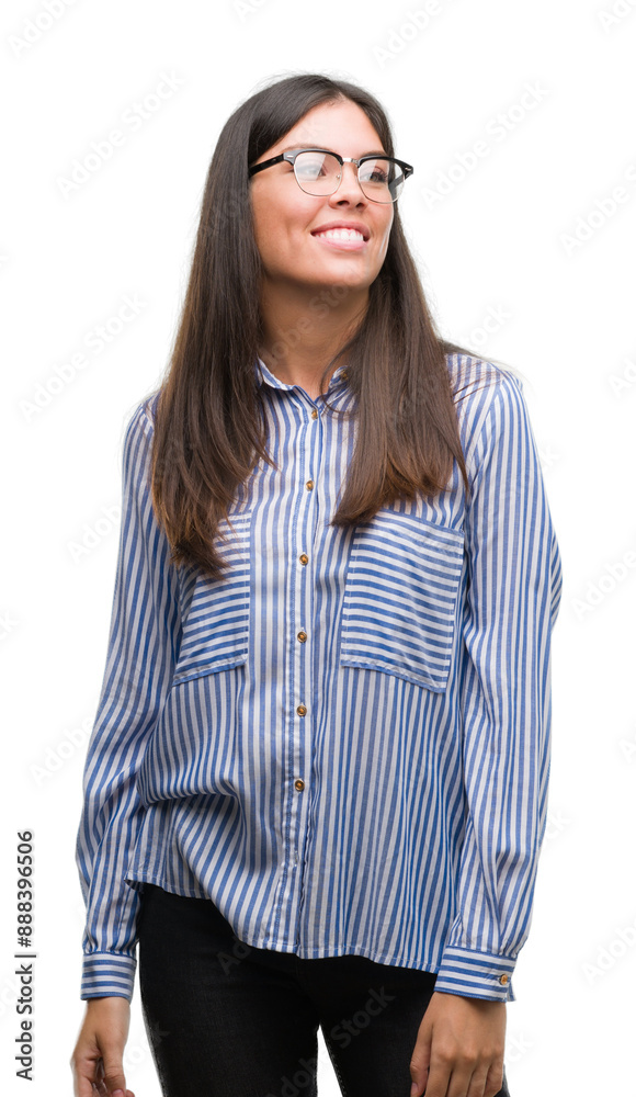 Poster Young beautiful hispanic business woman looking away to side with smile on face, natural expression. Laughing confident.