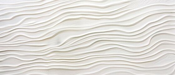 Fototapeta premium A white, wavy textured wall creates a soothing and minimalistic pattern, captured in an elegant, monochromatic design.