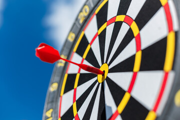 Successful winning target on blue sky. Victory and success, creative idea. Goal and result, win....