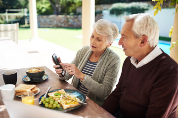 Cellphone, senior couple and garden for breakfast, online and picture for memory in home. Morning, mobile app or meal for nutrition in morning, backyard or married people for love or support together