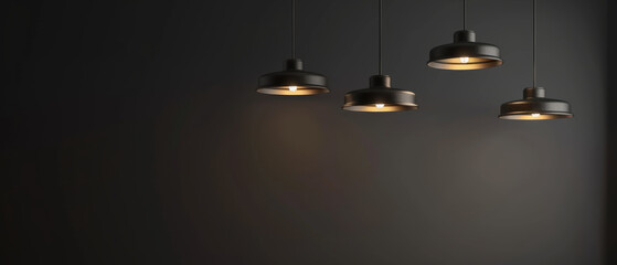 Four industrial pendant lights casting a gentle, warm glow against a dark, minimalist background, evoking simplicity and modern elegance.