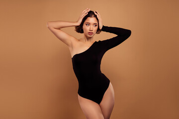 Photo of pretty shiny lady wear off shoulder black bodysuit enjoy haircare empty space isolated...