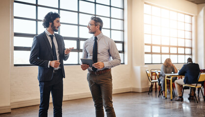 Tablet, team and business men brainstorming, research or discussion of ideas with mentor for...