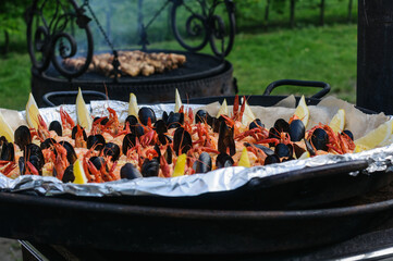 Crayfish, mussels, shrimp. A large beautiful dish with seafood delicacies on the street during the festival. Selective focus