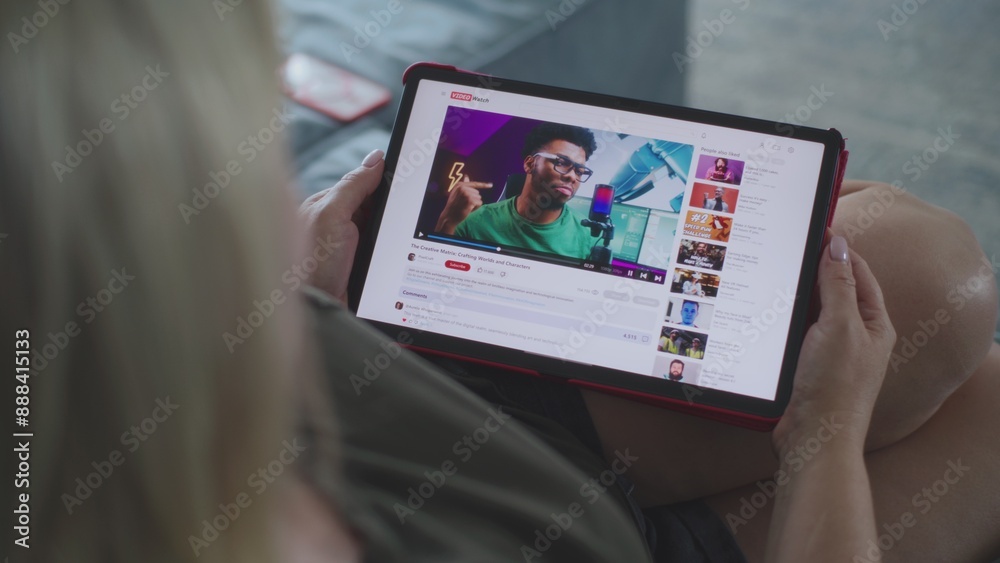 Poster caucasian woman watches educational video of blogger about 3d modeling using tablet computer while l