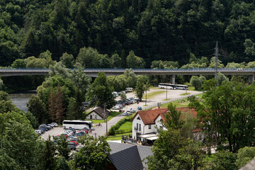 Fototapeta premium Small town surrounded by mountains in a summer landscape