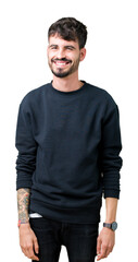 Fototapeta premium Young handsome man over isolated background winking looking at the camera with sexy expression, cheerful and happy face.