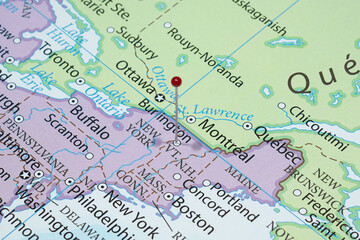 Close up to a Burlington city with a red pin needle into United States of America country political map 