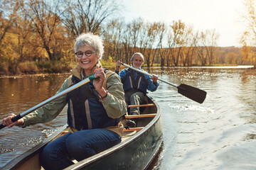 Lake, rowing and kayak with old couple, nature and retirement with happiness, relax and vacation....