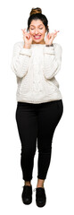 Obraz premium Young beautiful woman wearing winter sweater smiling crossing fingers with hope and eyes closed. Luck and superstitious concept.