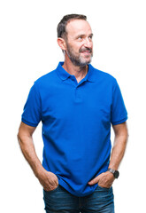 Fototapeta premium Middle age hoary senior man over isolated background smiling looking side and staring away thinking.