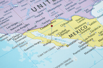 Close up to a Mulege city with a red pin needle into Mexico country political map 